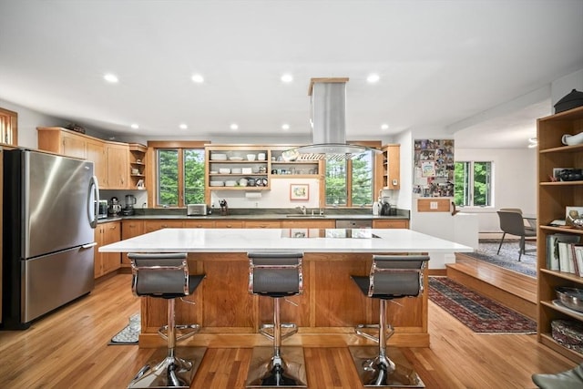 424 Sudbury St, Marlborough, MA 01752 - kitchen with open shelves, freestanding refrigerator, island range hood, light wood finished floors, and recessed lighting