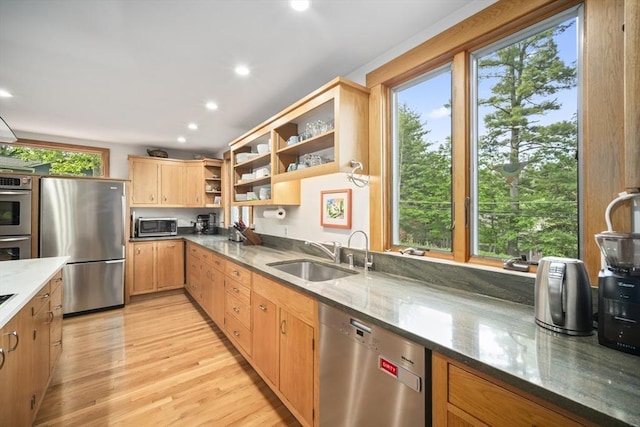 424 Sudbury St, Marlborough, MA 01752 - kitchen with stainless steel appliances, a sink, open shelves, stone counters, and light wood-type flooring