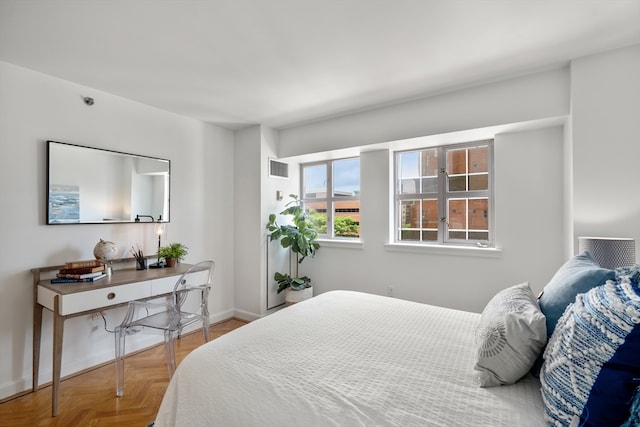 bedroom with parquet flooring