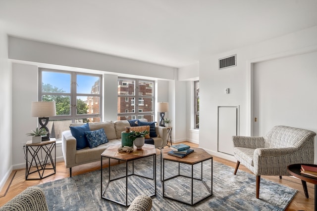 living room featuring parquet flooring