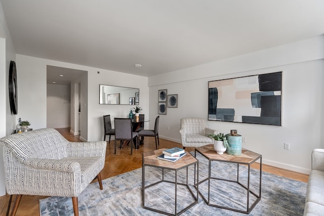 living room featuring parquet floors