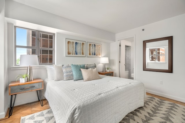 bedroom featuring light parquet flooring