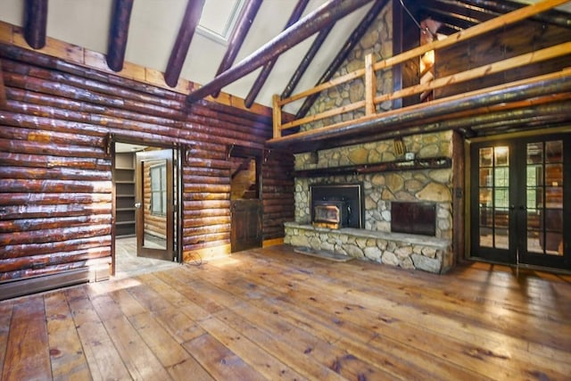 135 Pine St, Rochester, MA 02770 - unfurnished living room with high vaulted ceiling, french doors, hardwood / wood-style floors, beamed ceiling, and a fireplace