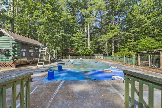 135 Pine St, Rochester, MA 02770 - view of pool with a water slide, a patio area, and an outbuilding