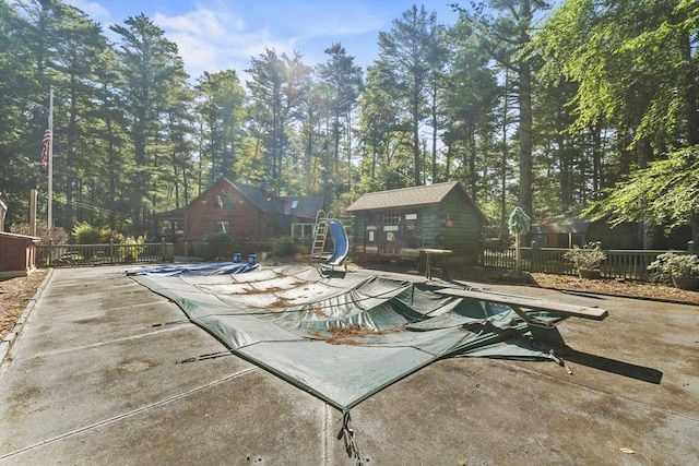 135 Pine St, Rochester, MA 02770 - view of swimming pool with a water slide, a patio area, and an outdoor structure