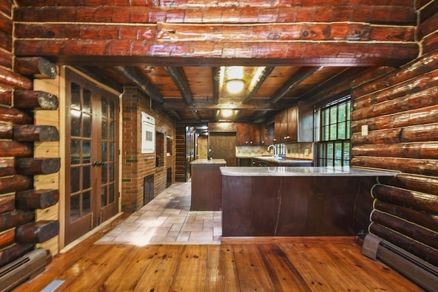 135 Pine St, Rochester, MA 02770 - kitchen with a baseboard radiator, hardwood / wood-style flooring, a peninsula, wood ceiling, and light countertops