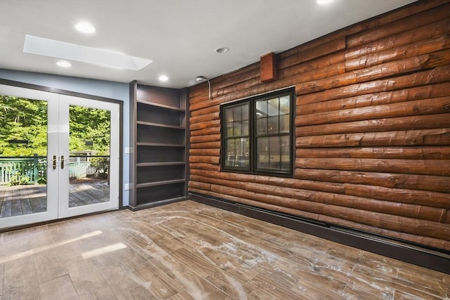 135 Pine St, Rochester, MA 02770 - unfurnished room with rustic walls, french doors, recessed lighting, a skylight, and wood finished floors
