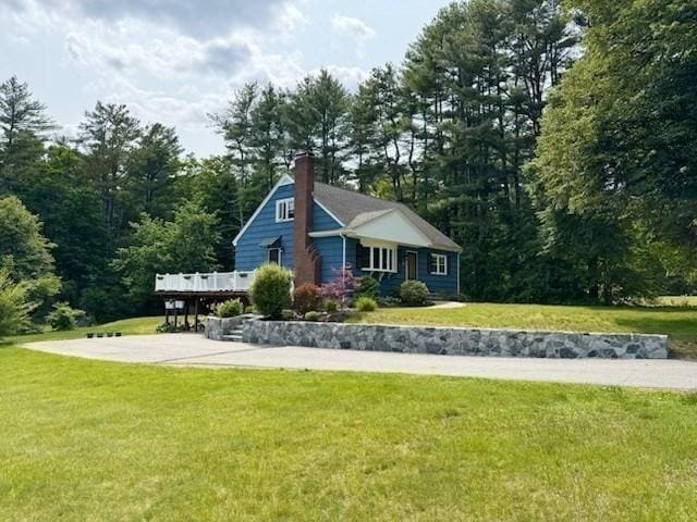 331 Townsend Rd, Groton, MA 01450 - back of property with a chimney, a lawn, and a wooden deck