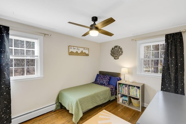 331 Townsend Rd, Groton, MA 01450 - bedroom featuring baseboard heating, wood finished floors, and ceiling fan