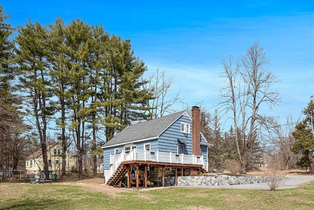 331 Townsend Rd, Groton, MA 01450 - back of house featuring a wooden deck, stairs, a yard, a chimney, and a shingled roof