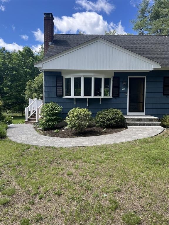 331 Townsend Rd, Groton, MA 01450 - view of side of home featuring a chimney, roof with shingles, and a yard