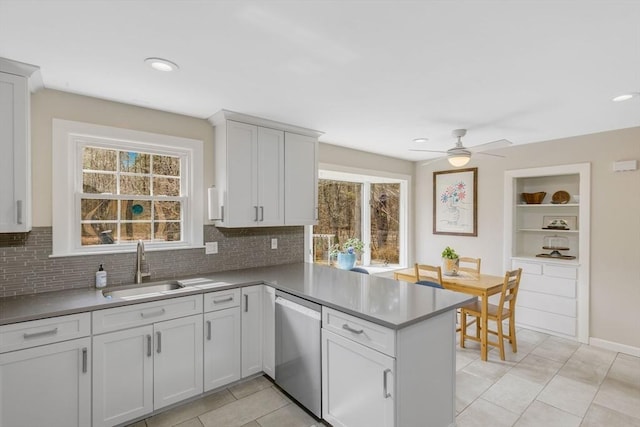 331 Townsend Rd, Groton, MA 01450 - kitchen featuring stainless steel dishwasher, a peninsula, tasteful backsplash, ceiling fan, and white cabinets