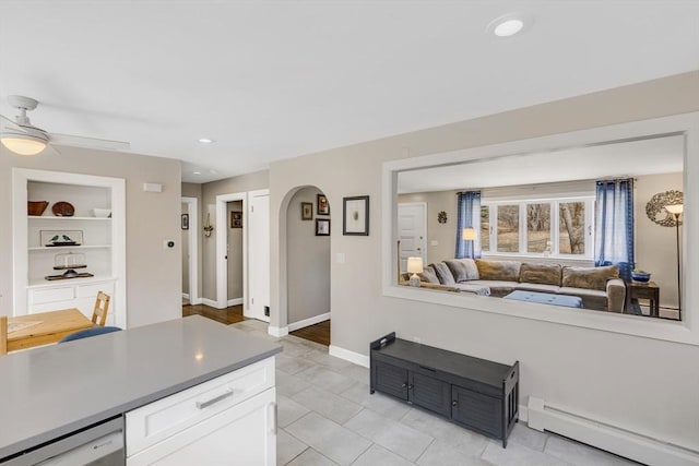 331 Townsend Rd, Groton, MA 01450 - living area with a baseboard heating unit, light tile patterned floors, ceiling fan, arched walkways, and recessed lighting
