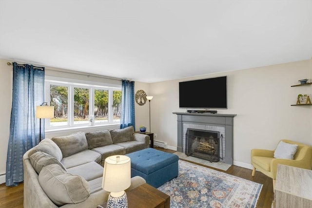 331 Townsend Rd, Groton, MA 01450 - living room featuring a baseboard heating unit, a brick fireplace, and wood finished floors