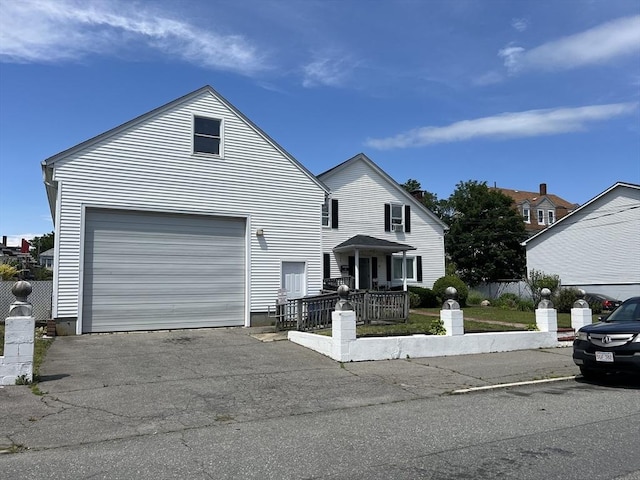 61 Belleville Rd, New Bedford, MA 02745 - traditional-style home with fence, aphalt driveway, and a garage