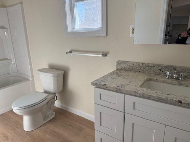 61 Belleville Rd, New Bedford, MA 02745 - full bathroom featuring toilet, wood finished floors, vanity, and baseboards