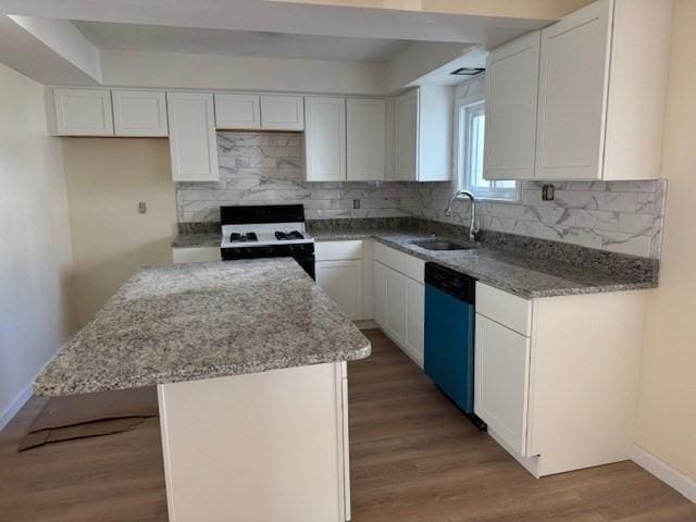61 Belleville Rd, New Bedford, MA 02745 - kitchen with light stone countertops, a sink, a center island, dishwashing machine, and range with gas cooktop