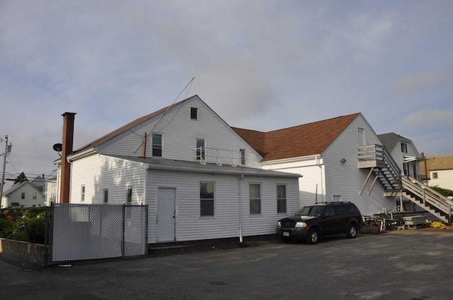 61 Belleville Rd, New Bedford, MA 02745 - rear view of property with fence and stairs