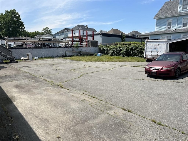 61 Belleville Rd, New Bedford, MA 02745 - view of parking / parking lot featuring a residential view