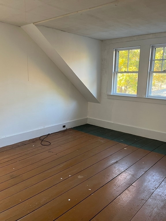 bonus room featuring dark hardwood / wood-style flooring