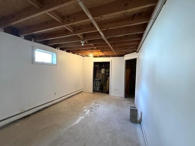 basement featuring a baseboard radiator