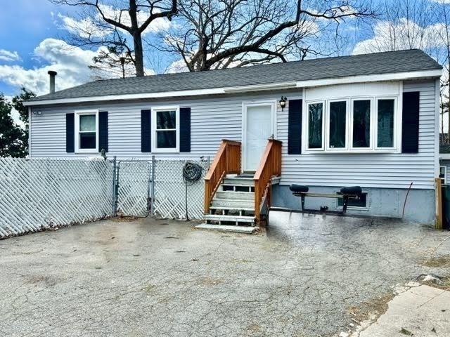 view of front of home with fence