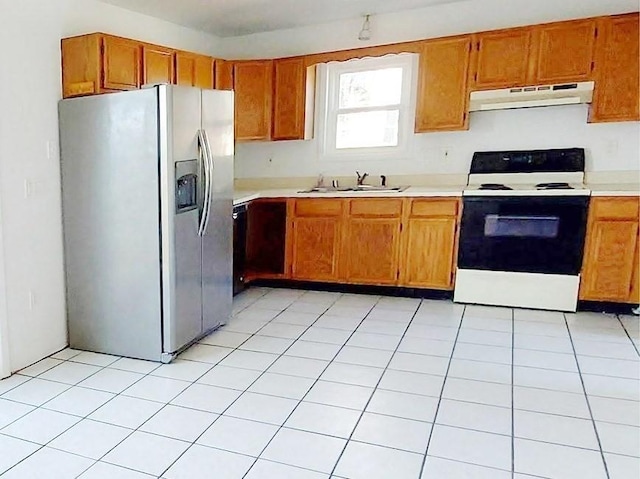 kitchen with a sink, electric range oven, light countertops, stainless steel refrigerator with ice dispenser, and under cabinet range hood