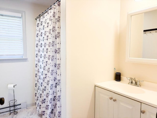 110 W Main St Unit 30, Barnstable, MA 02601 - bathroom with a baseboard heating unit, vanity, marble finish flooring, and a shower with curtain