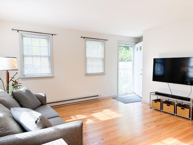 110 W Main St Unit 30, Barnstable, MA 02601 - living room featuring a baseboard radiator, wood finished floors, and baseboards