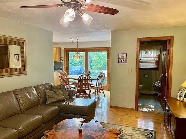 15 Shufelt Rd, Walpole, MA 02071 - living area featuring ceiling fan, light wood finished floors, and baseboards