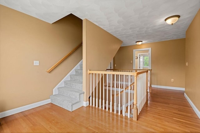 160 Wharton Row, Groton, MA 01450 - hallway with wood finished floors and an upstairs landing