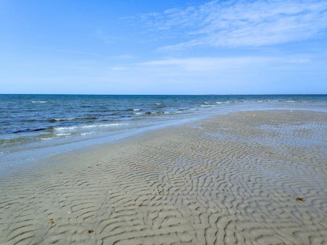 property view of water featuring a beach view