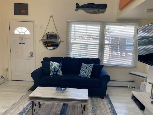 living room featuring light hardwood / wood-style flooring and a baseboard radiator