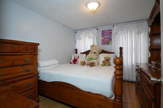 bedroom with wood finished floors