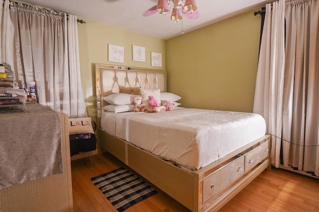 bedroom featuring a ceiling fan and hardwood / wood-style flooring