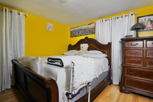 bedroom featuring hardwood / wood-style floors