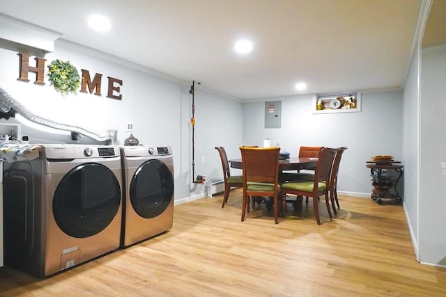 laundry area featuring light wood-type flooring, electric panel, recessed lighting, separate washer and dryer, and crown molding