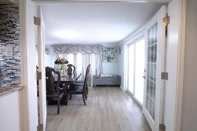 dining space with light wood-style floors