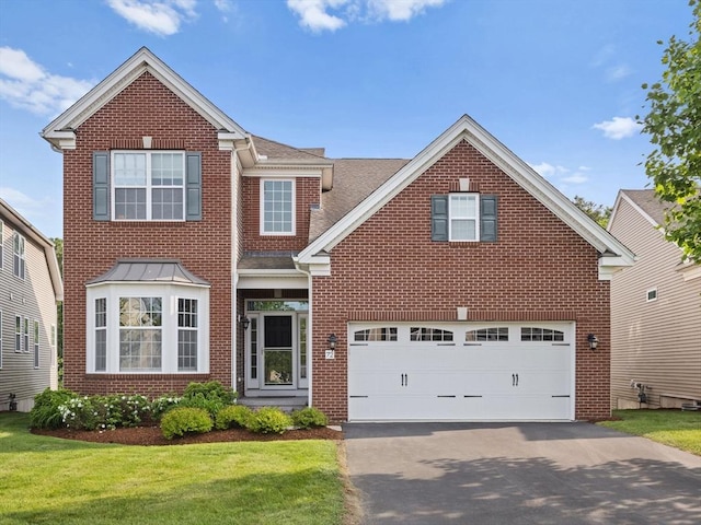72 Sherwood Dr Unit 72, Methuen, MA 01844 - traditional home with brick siding, driveway, and a shingled roof