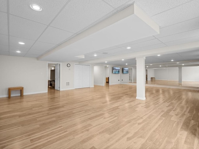 72 Sherwood Dr Unit 72, Methuen, MA 01844 - basement featuring light wood-style flooring and a drop ceiling