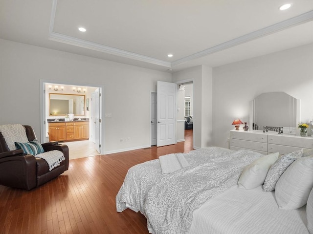 72 Sherwood Dr Unit 72, Methuen, MA 01844 - bedroom with a tray ceiling, light wood-style floors, ornamental molding, recessed lighting, and ensuite bath