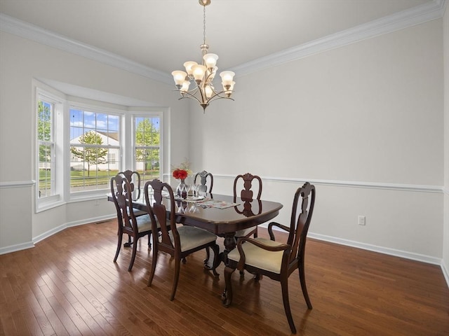 72 Sherwood Dr Unit 72, Methuen, MA 01844 - dining area featuring crown molding, a chandelier, and dark wood-type flooring