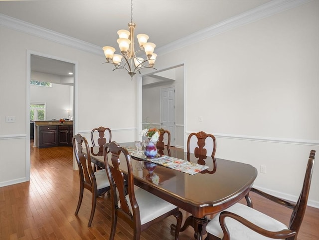 72 Sherwood Dr Unit 72, Methuen, MA 01844 - dining area featuring wood finished floors, ornamental molding, and a chandelier