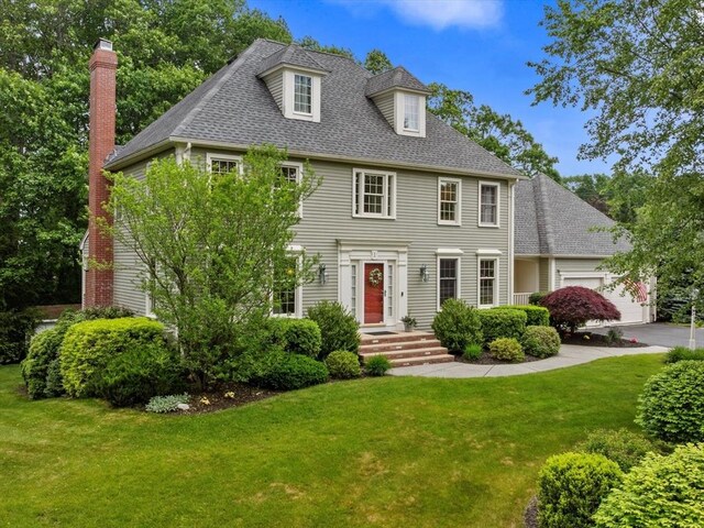 1 Benjamin Dr, Westborough, MA 01581 - view of front of home with a garage, a front lawn, a shingled roof, and a chimney