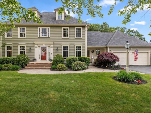 1 Benjamin Dr, Westborough, MA 01581 - colonial inspired home with a front lawn, an attached garage, asphalt driveway, and a shingled roof