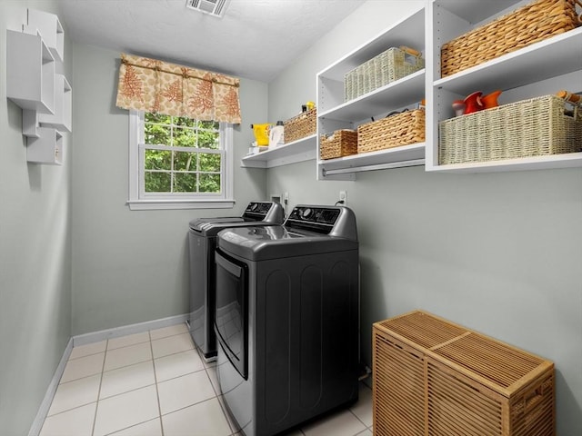 1 Benjamin Dr, Westborough, MA 01581 - laundry room featuring washer and dryer, light tile patterned floors, and baseboards