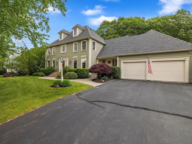 1 Benjamin Dr, Westborough, MA 01581 - colonial inspired home featuring a front lawn, driveway, an attached garage, and roof with shingles