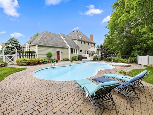 1 Benjamin Dr, Westborough, MA 01581 - view of swimming pool with a patio area, a fenced backyard, and a gate