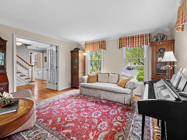 1 Benjamin Dr, Westborough, MA 01581 - living room featuring wood finished floors, crown molding, stairs, and french doors