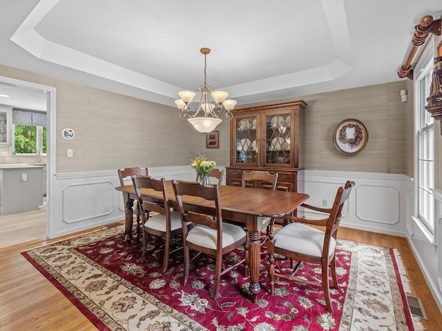 1 Benjamin Dr, Westborough, MA 01581 - dining area with wainscoting, wallpapered walls, a tray ceiling, light wood finished floors, and a chandelier